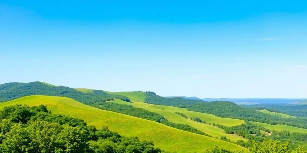 Scenic Alabama landscape with hills and clear sky.