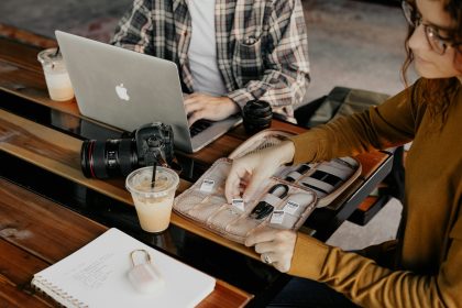 man in white and black plaid dress shirt using macbook; Freelancer Habits
