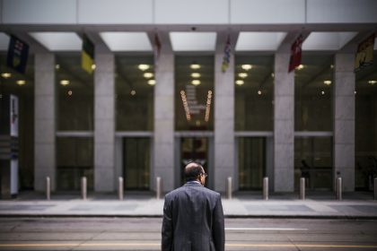 man standing in front of building; Quit Your 9-to-5