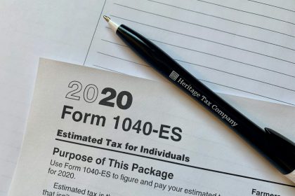 a pen sitting on top of a tax form; Tax Moves