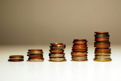 Stacks of coins increasing in height from left to right.;raise freelance rates