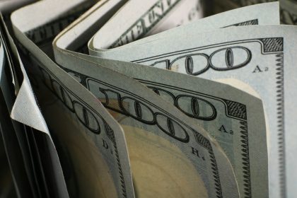 A close-up of us hundred dollar bills fanned out.; quick revenue without discounting