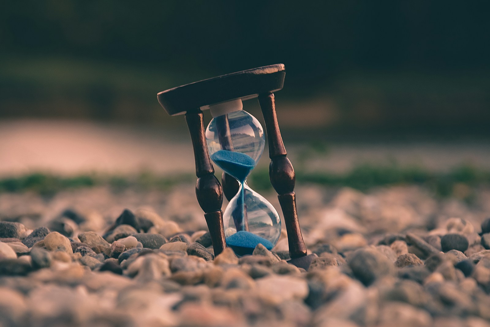 selective focus photo of brown and blue hourglass on stones; self-employed tax changes 2026