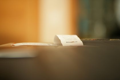a piece of paper sitting on top of a table; invoice late fee