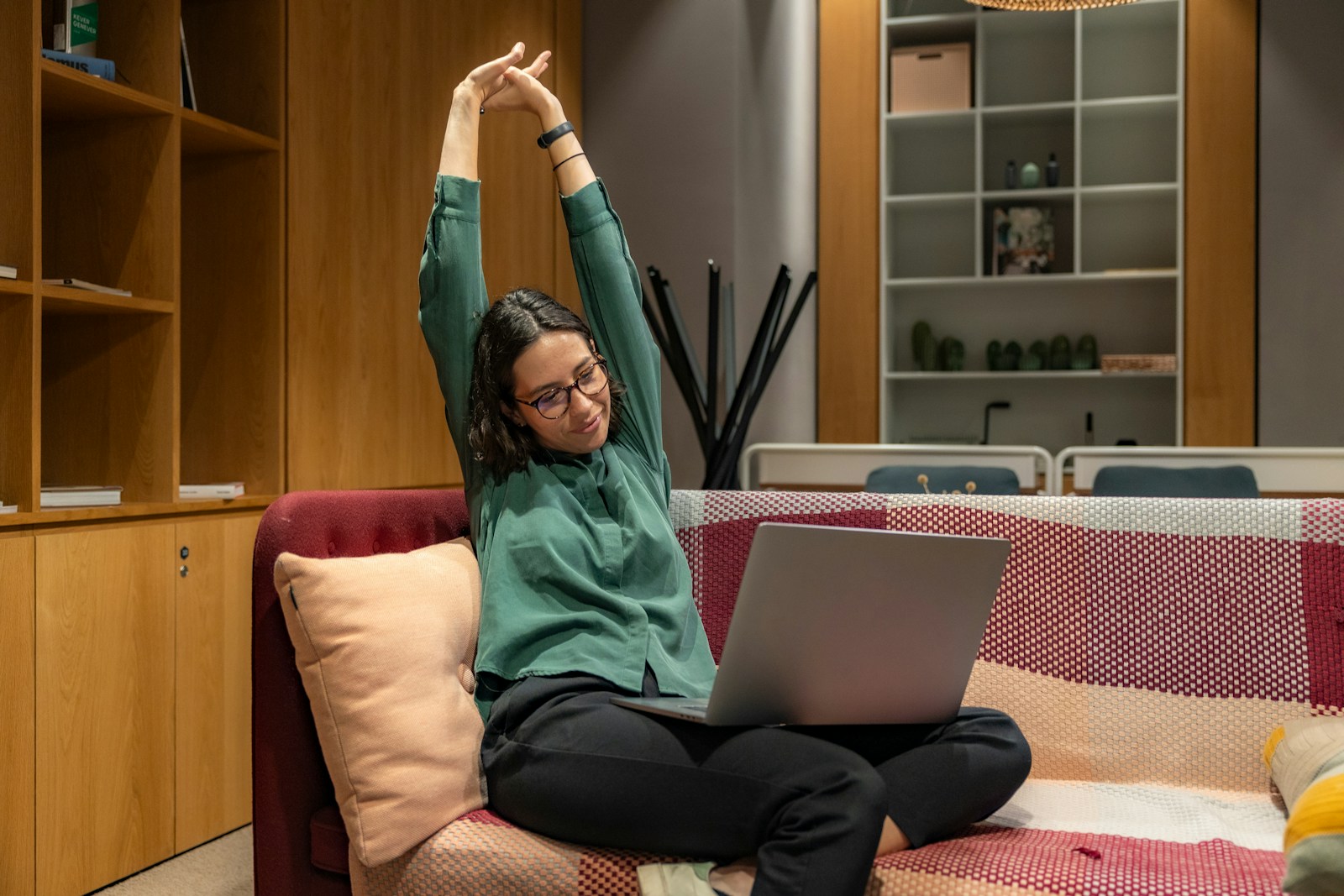 a woman sitting on a couch using a laptop; slow months