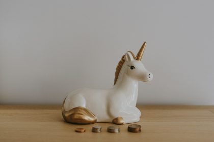 white and gold ceramic unicorn figurine near coins; what is a sep ira