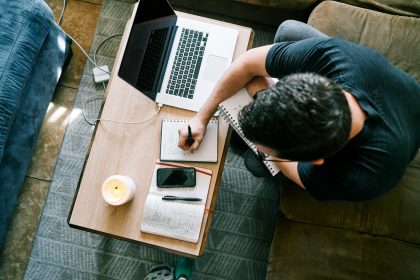 man in black t-shirt sitting at the table using macbook pro; slow season mistakes