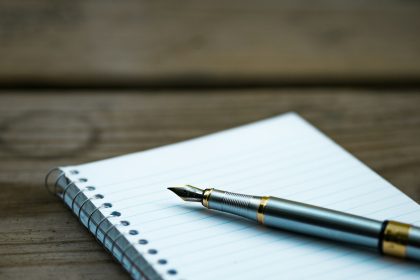 fountain pen on spiral book; how to write a scope of work