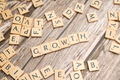 scrabbled letters spelling growth on a wooden surface; freelance economy growth 2026