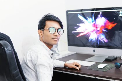 man using iMac; client management software