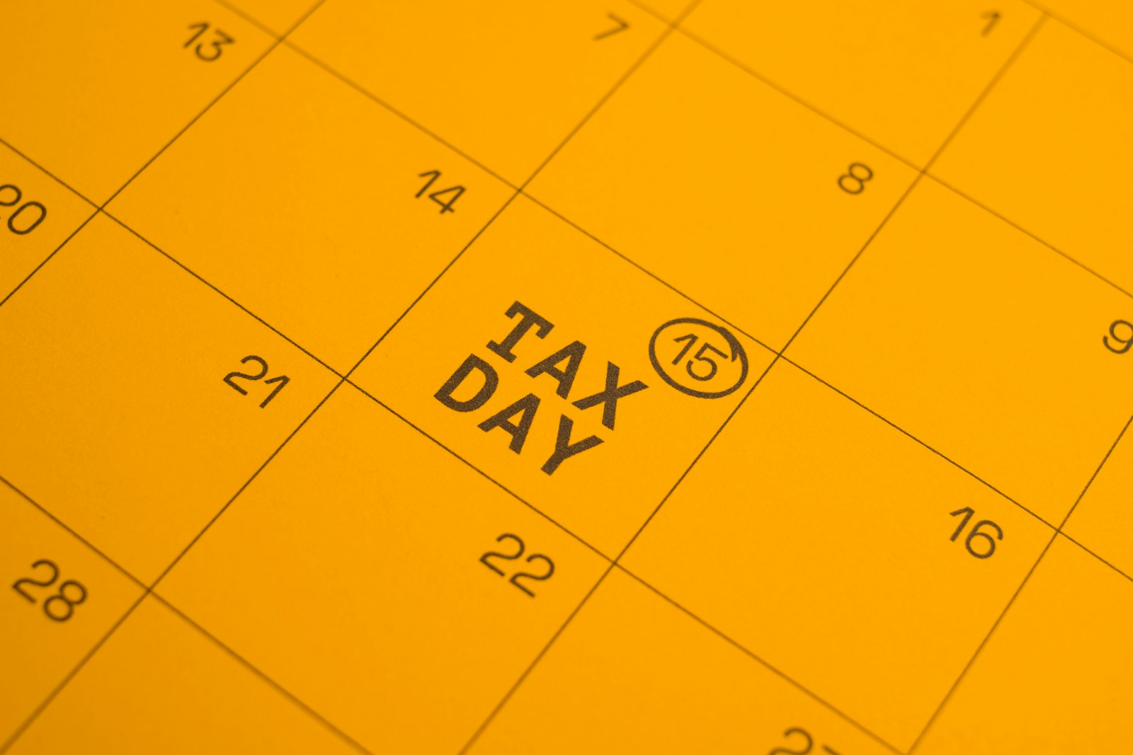 Calendar shows "tax day" circled on the 15th; 1099 reporting threshold 2026