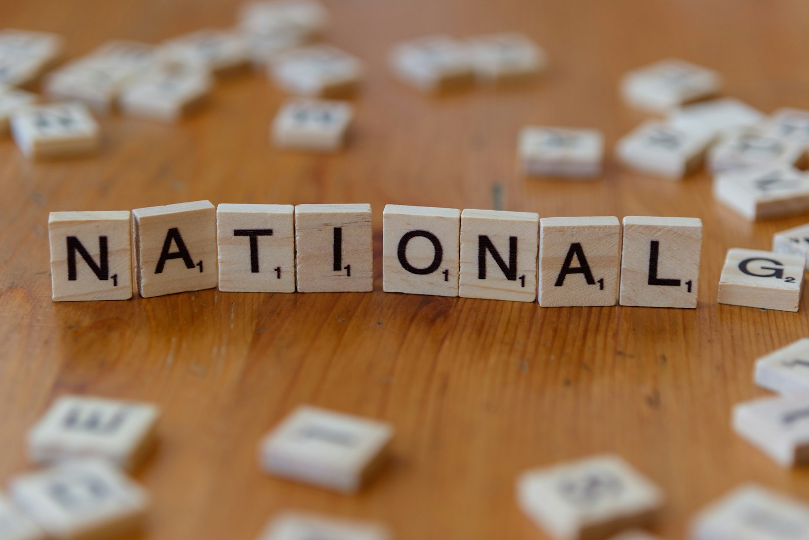 Scrabble tiles spell the word: national; National Freelance Business Week