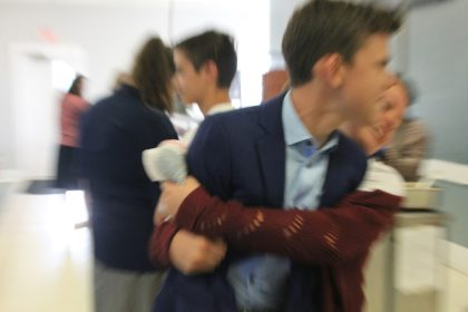 a man holding a baby in his arms; how to fire a client