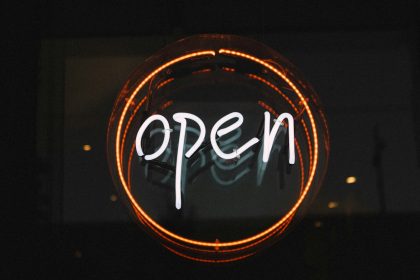 white and orange open LED signage turned on; IRS Saturday hours