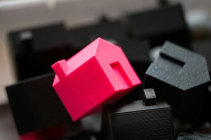 A group of black and pink objects sitting on top of a table; home loans