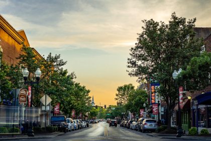 landscape photography of vehicles parked on side of a street; State of Main Street 2026