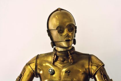 person wearing gold mask and mask; solo founders AI