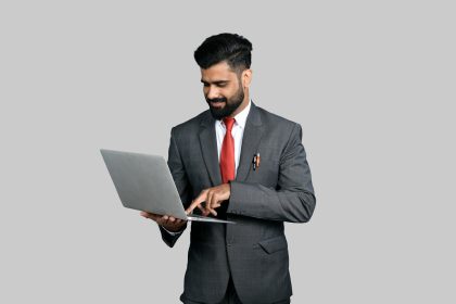 a man holding a laptop; what is a 1099 employee