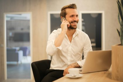 man using smartphone on chair; how long does it take to get an llc