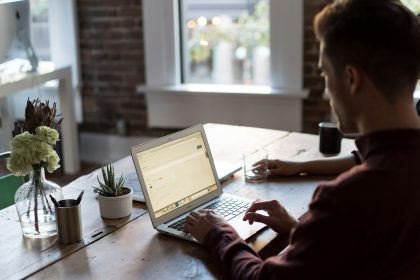 man operating laptop on top of table; project brief