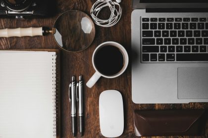 cup of coffee near MacBook Pro; how to set up a home office