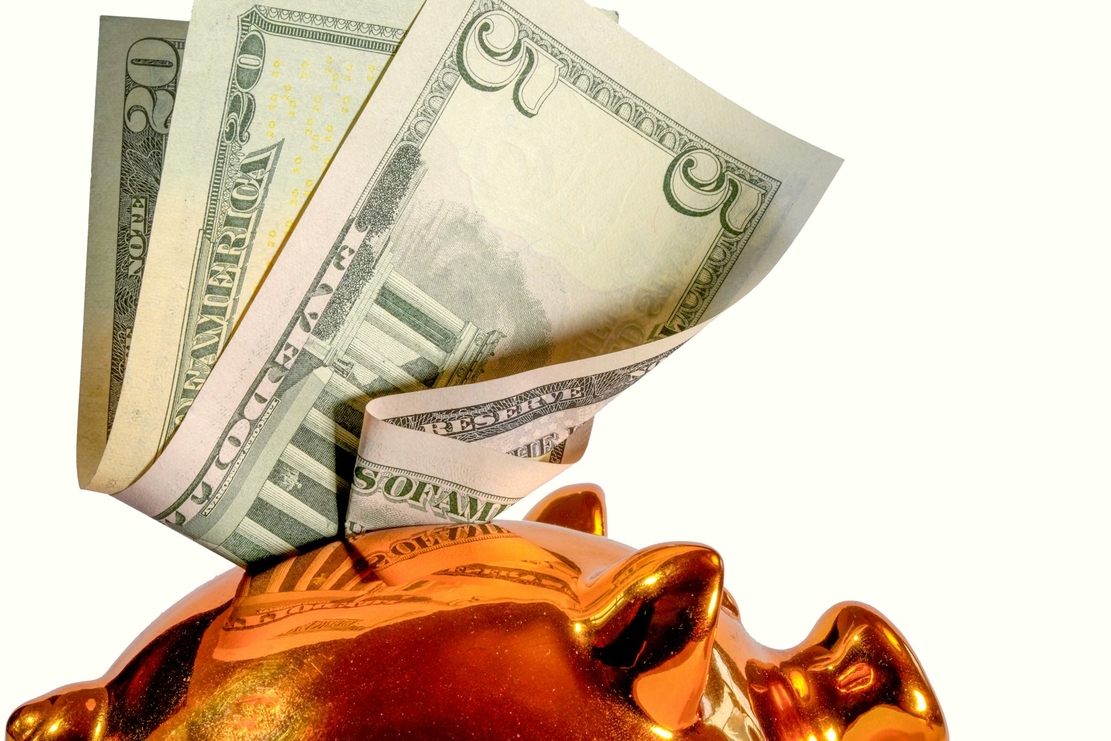 Us dollar bills being inserted into a piggy bank; small business AI spending