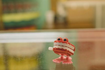 a red toy on a table; dental insurance