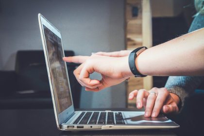 person using laptop; what is revenue