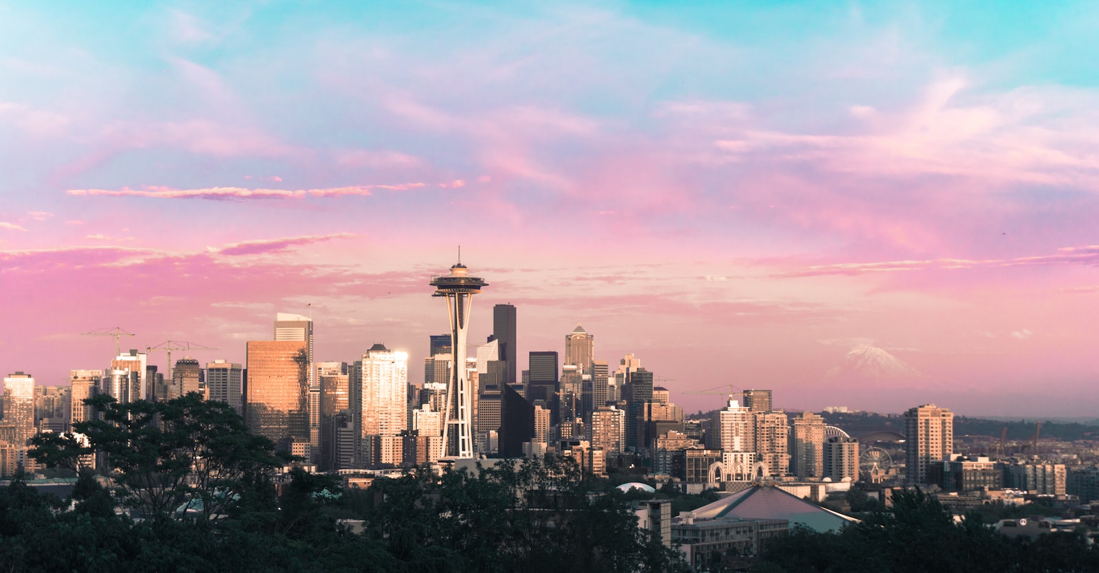 highrise buildings under pink and blue sky during daytime, Seattle gig worker pay law report
