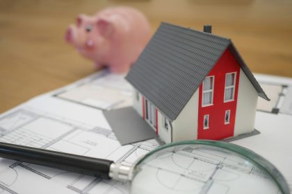 white and red wooden house beside grey framed magnifying glass; mortgage readiness