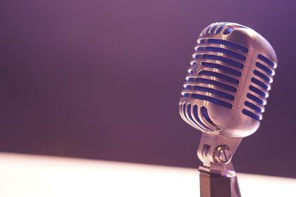 condenser microphone with black background; how to start a podcast