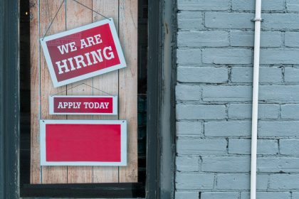 a sign that says we are hiring and apply today; Robert Half job search survey 2026