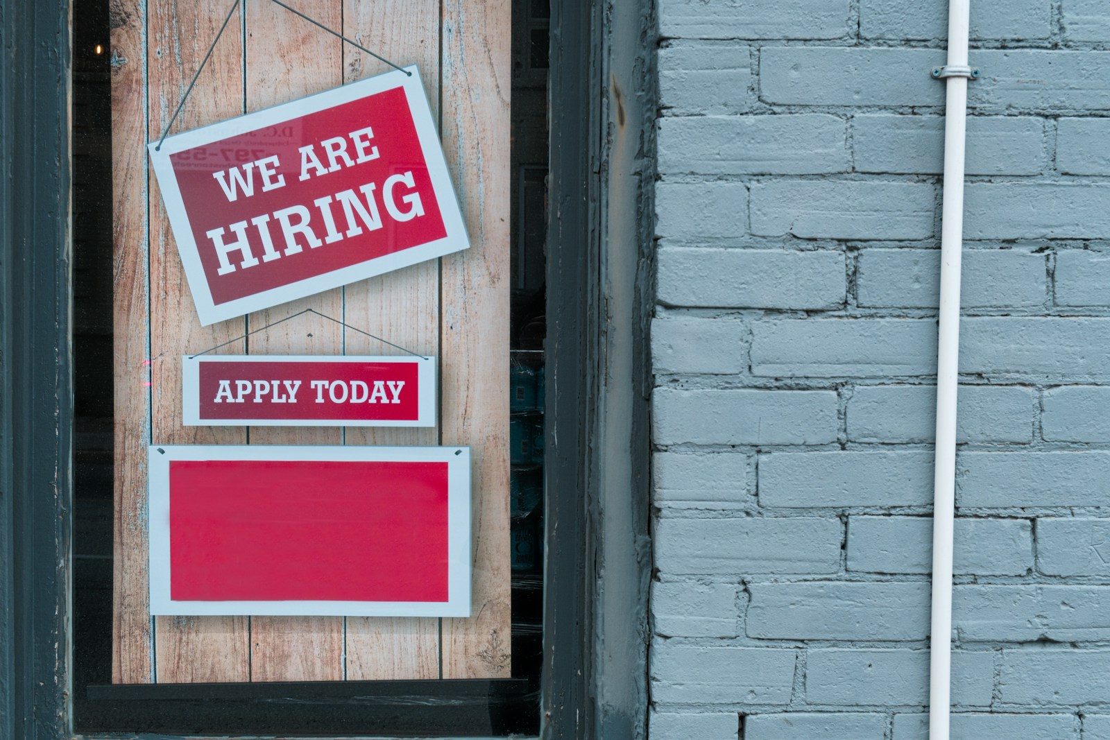 a sign that says we are hiring and apply today; Robert Half job search survey 2026