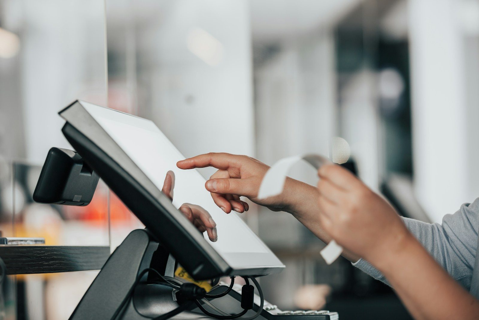 a person is using a pos machine in a store; durable goods orders June 2026