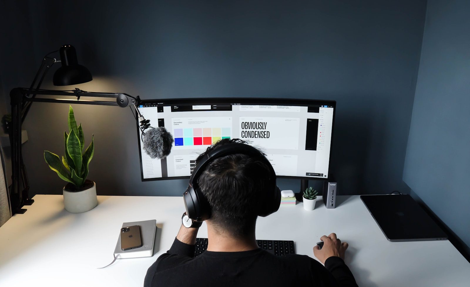 man in black shirt sitting in front of computer; tech freelancers
