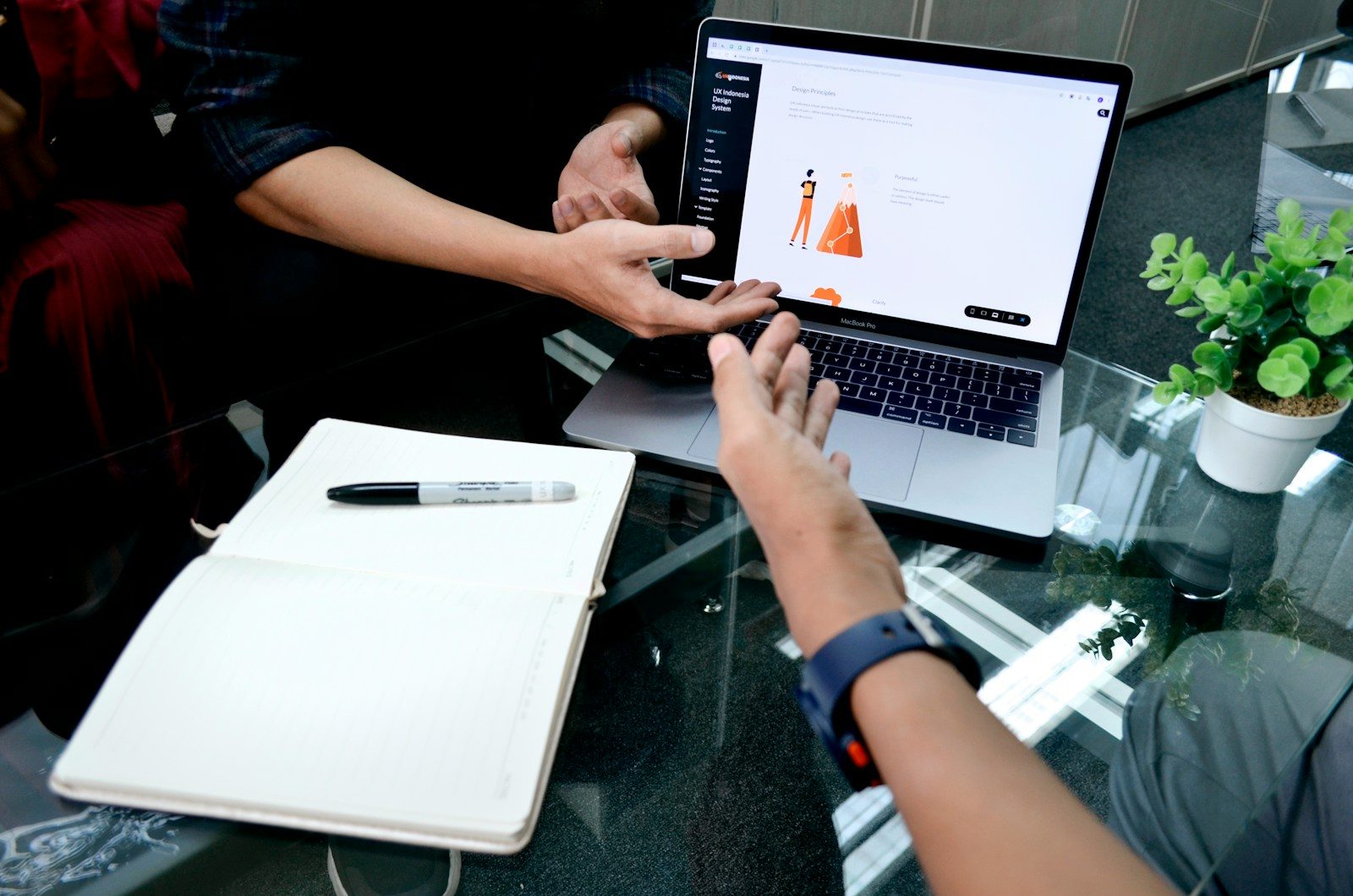 person using macbook pro on white table; Thryv AI growth platform