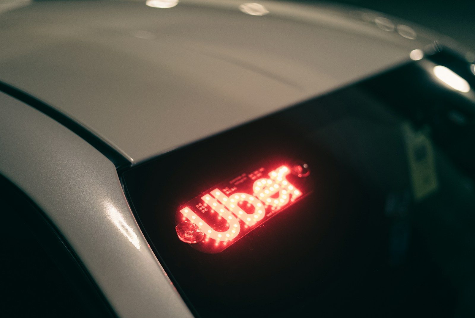 A close up of a car's tail light; Uber Q2 2026 earnings