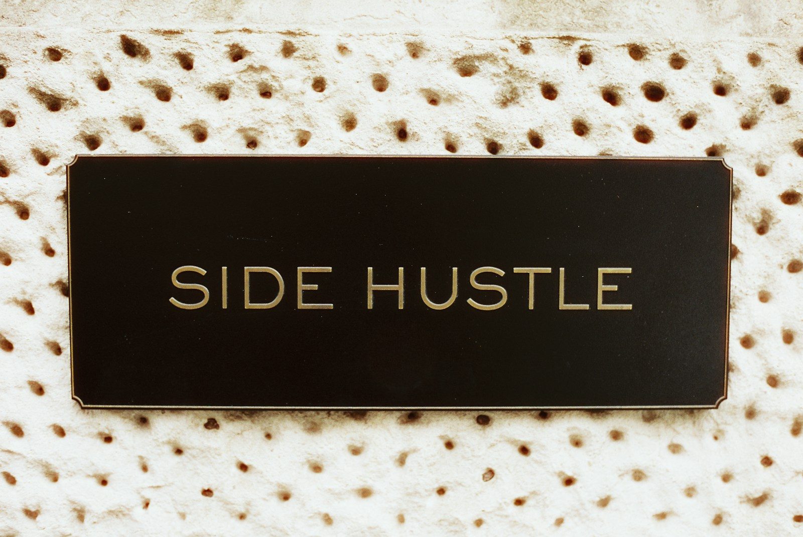 Black rectangle with "side hustle" text on textured background; side hustle statistics 2026