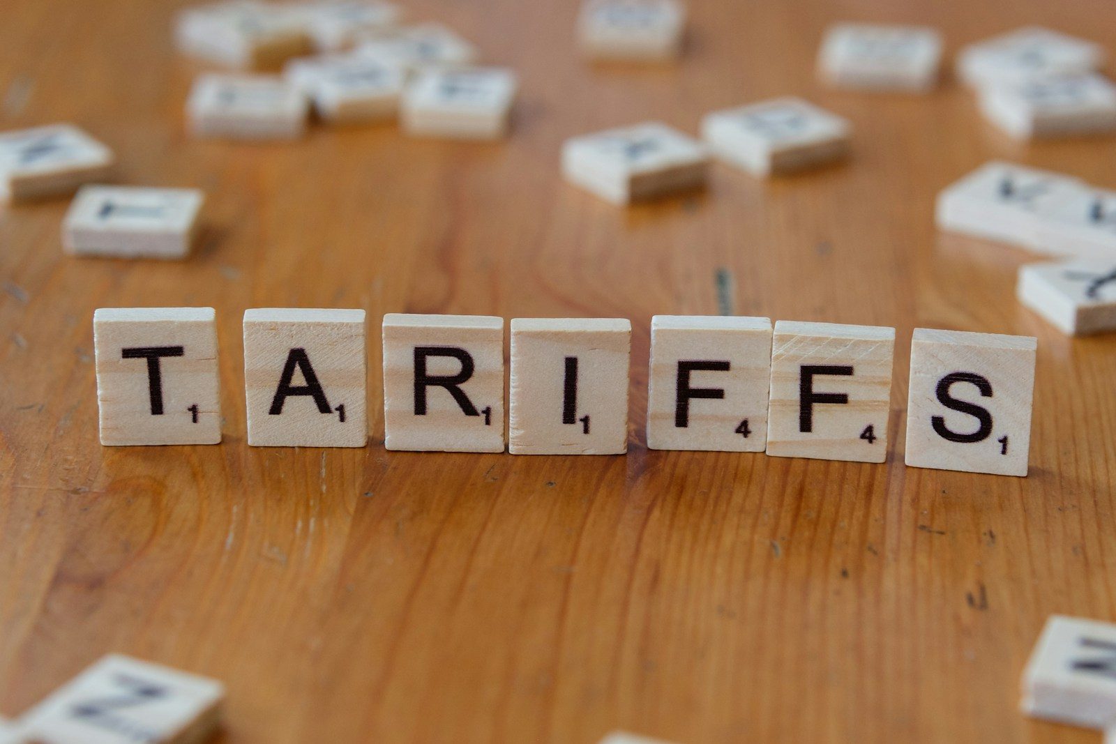 A wooden block spelling tarifs on a table; IEEPA tariff refunds