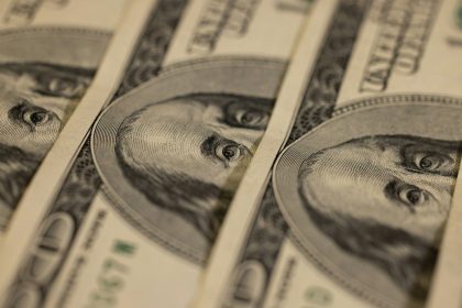 a close up of a bunch of money; June PCE inflation