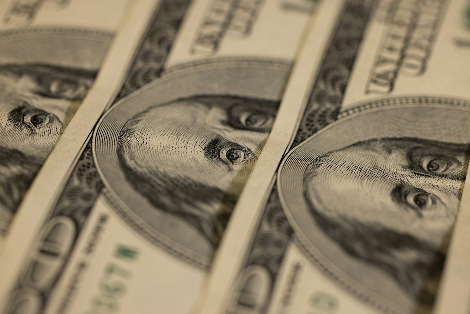 a close up of a bunch of money; June PCE inflation