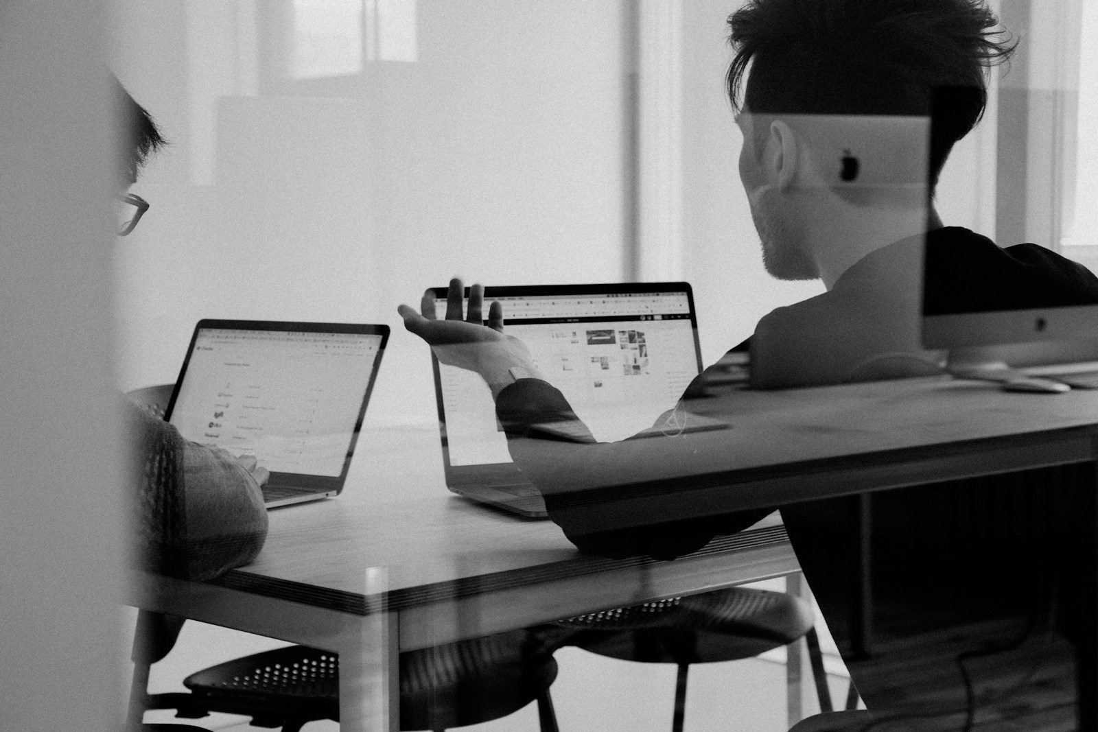 man using MacBook; small business cash crunch
