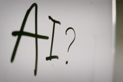 a sign with a question mark and a question mark drawn on it; AI side hustle scams