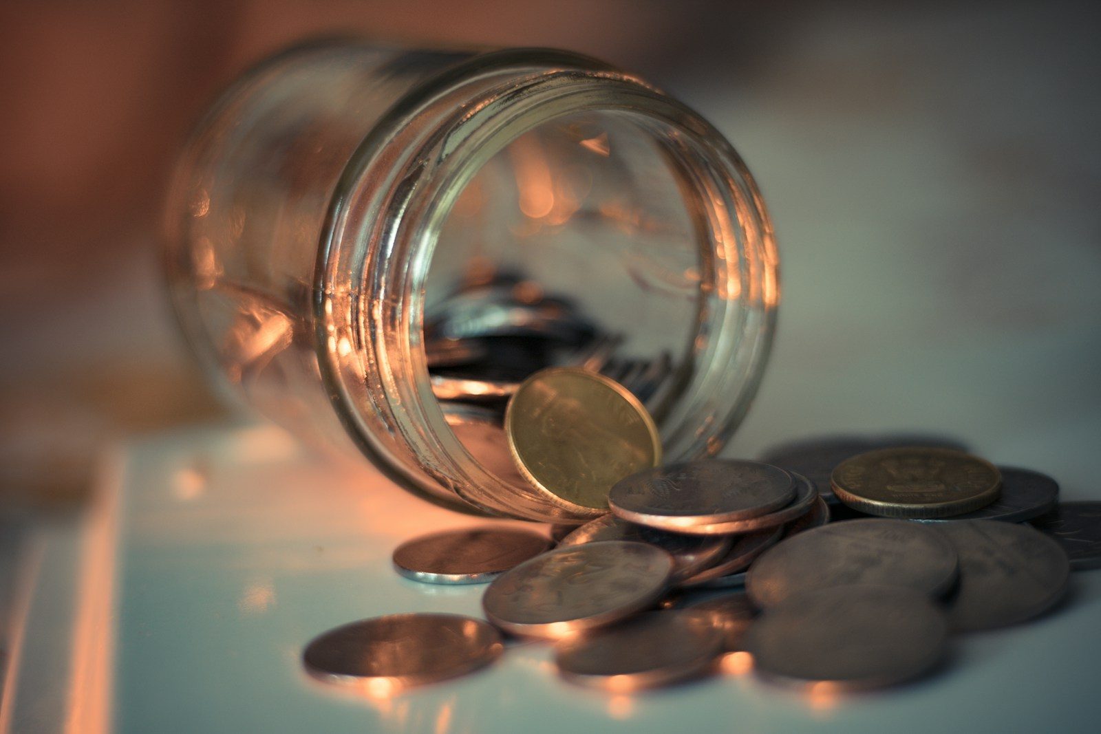 clear glass jar with coins; Saver's Match