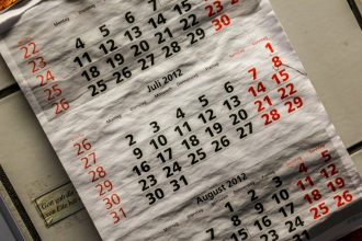 Calendar with red and white numbers; what is a fiscal year