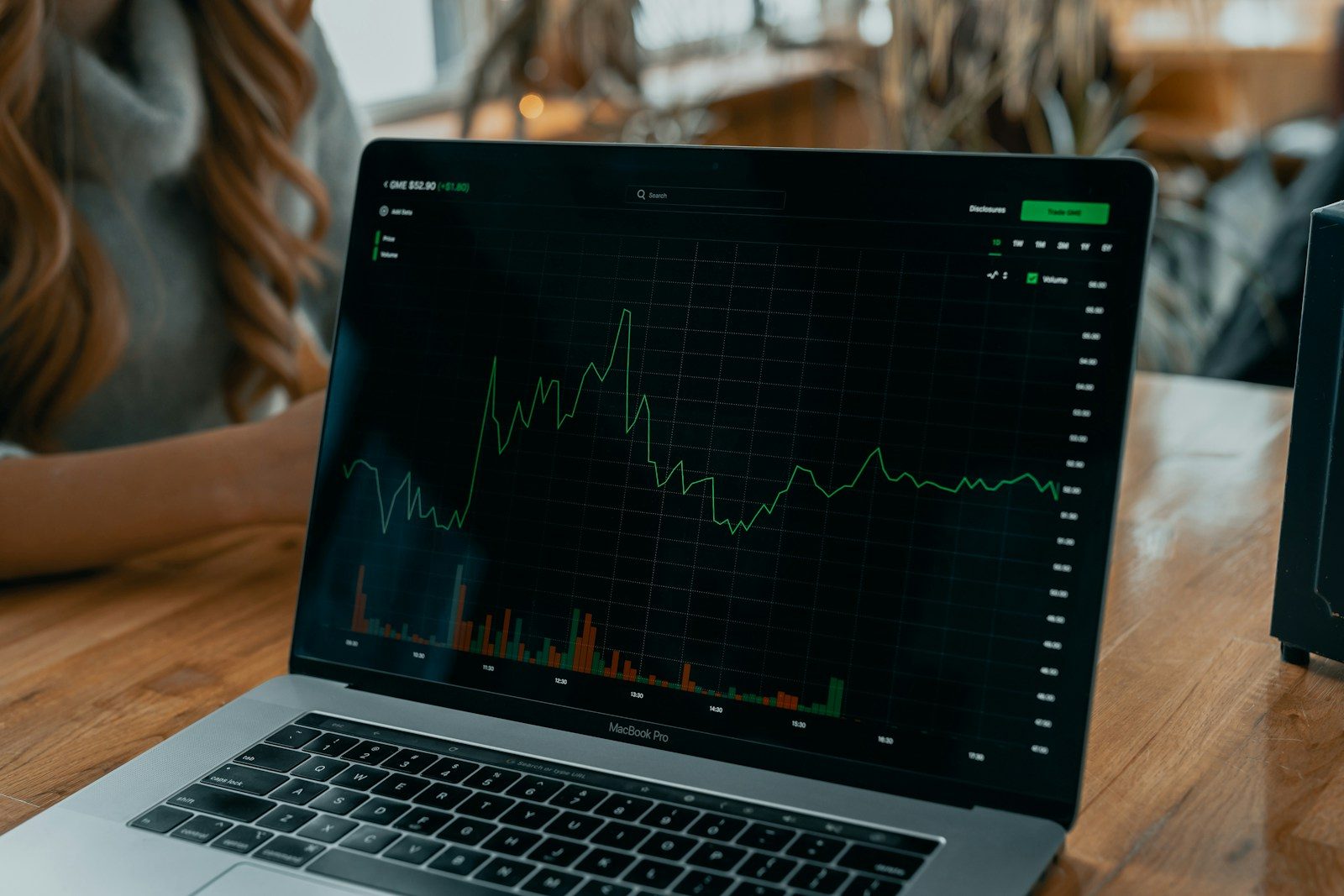 laptop showing stock chart on desk; Q2 GDP growth