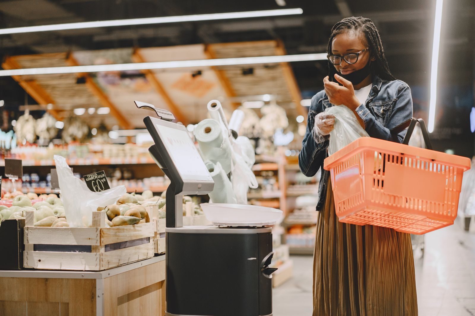 A woman shopping in a supermarket, checking items with a basket in hand; Meta Muse Instacart AI shopping