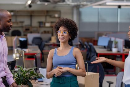 Self-employed professionals in a shared co-working space chatting; Self-Employed Health Coverage